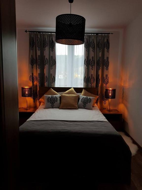 Posteľ alebo postele v izbe v ubytovaní Apartament Krupówki Centrum