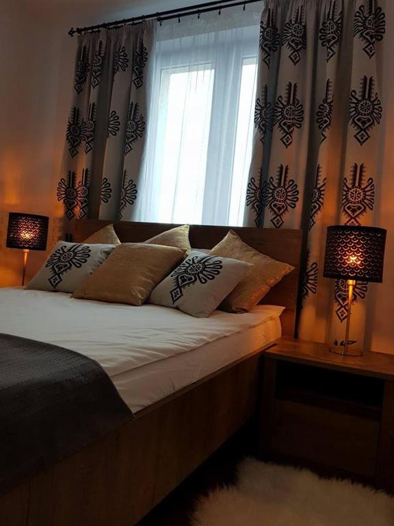 Posteľ alebo postele v izbe v ubytovaní Apartament Krupówki Centrum