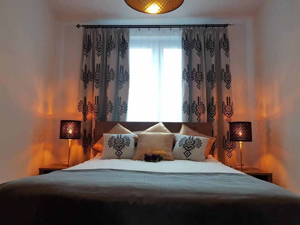 Posteľ alebo postele v izbe v ubytovaní Apartament Krupówki Centrum