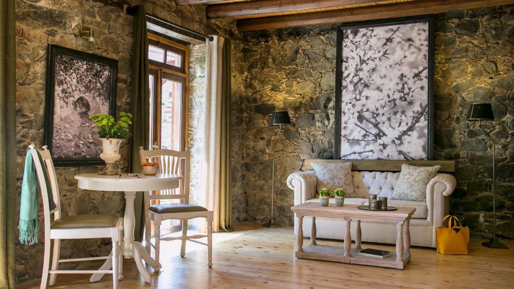 a room with two chairs and a table at Casale Panayiotis in Kalopanayiotis