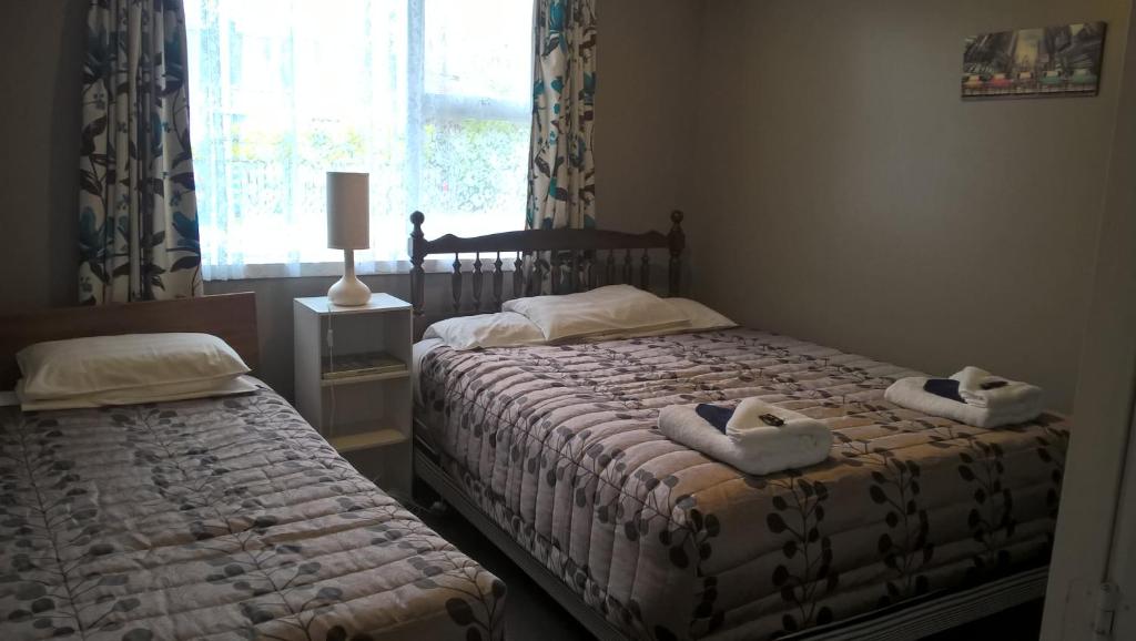 Postel nebo postele na pokoji v ubytování Mt Dobson Motel