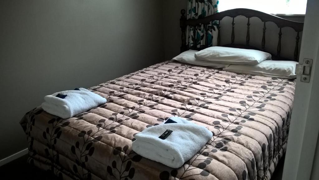 Postel nebo postele na pokoji v ubytování Mt Dobson Motel