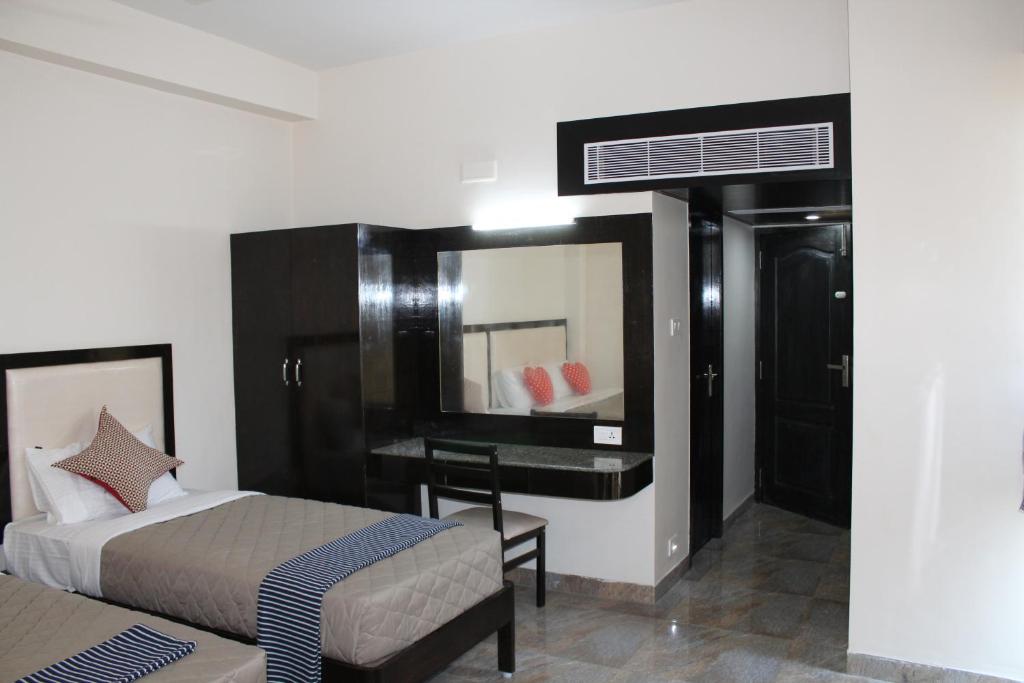 Postel nebo postele na pokoji v ubytování Hotel Jaidharshini Palace