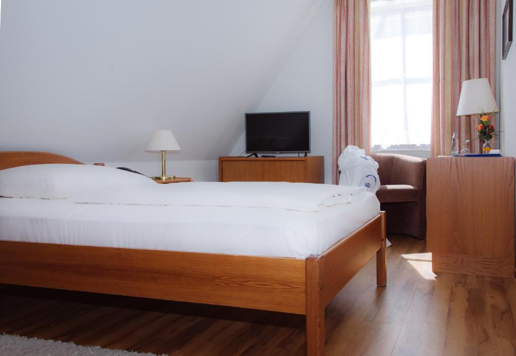 Postel nebo postele na pokoji v ubytování Hotel Deutscher Kaiser
