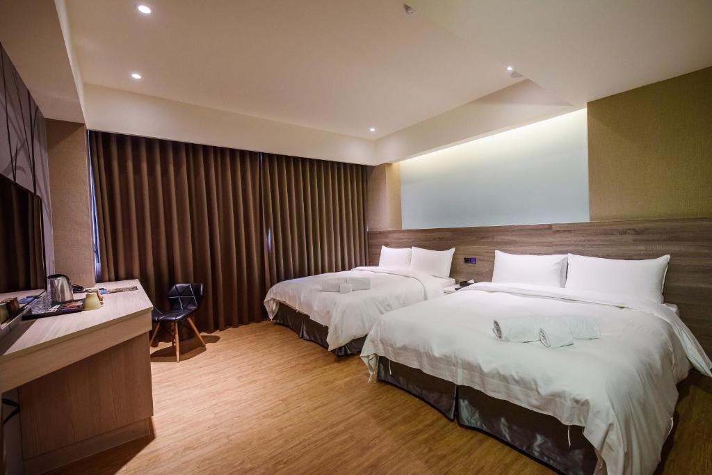 Postel nebo postele na pokoji v ubytování SIX FUKUN HOTEL