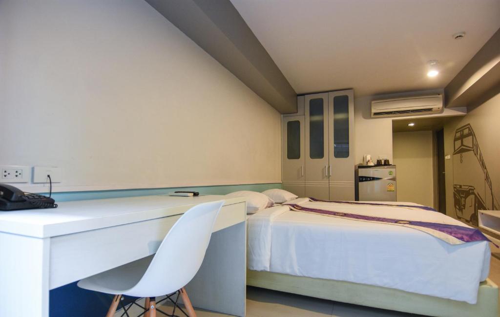 Postel nebo postele na pokoji v ubytování iSanook Bangkok