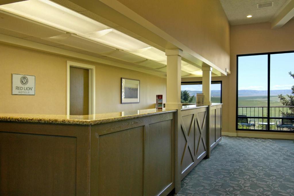 a large lobby with a view of the mountains at Red Lion Hotel Pendleton in Pendleton