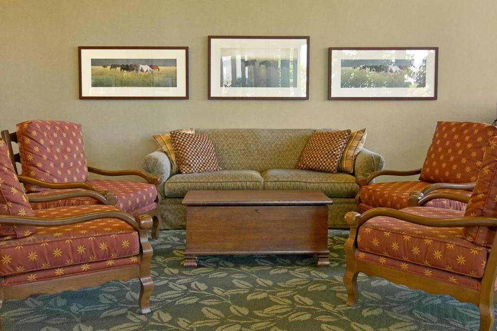 a living room with a couch and two chairs at Red Lion Hotel Pendleton in Pendleton