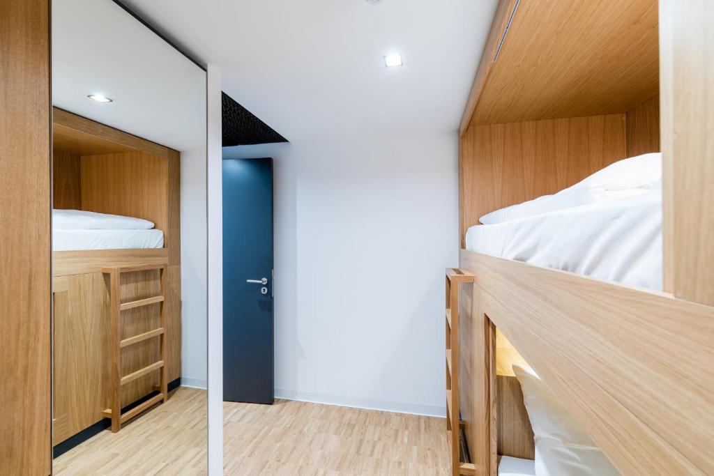 Postel nebo postele na pokoji v ubytování mk | hotel rüsselsheim