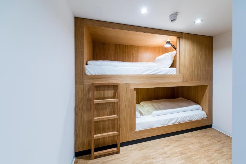 Postel nebo postele na pokoji v ubytování mk | hotel rüsselsheim