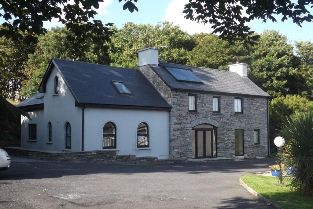 a house with solar panels on the roof at SunnySide-Cottage in Ennistymon
