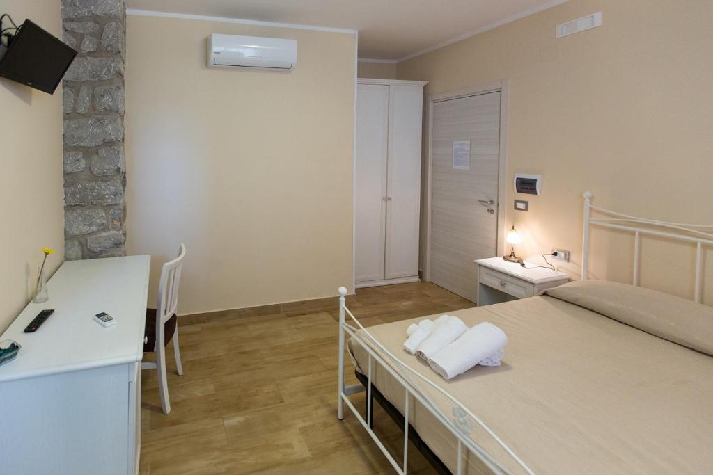 Postel nebo postele na pokoji v ubytování B&B Incanto del Mare
