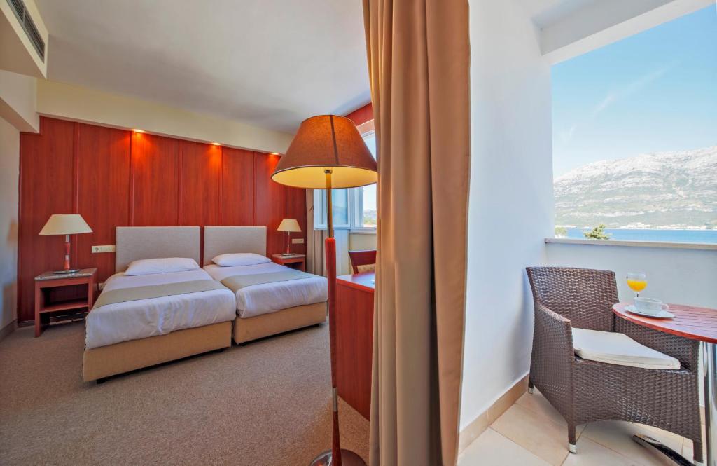 Postel nebo postele na pokoji v ubytování Marko Polo Maradiso Hotel by Aminess