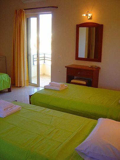 Postel nebo postele na pokoji v ubytování Ostria Hotel