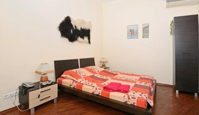 Ліжко або ліжка в номері KyivStay Yaroslavska Apartment