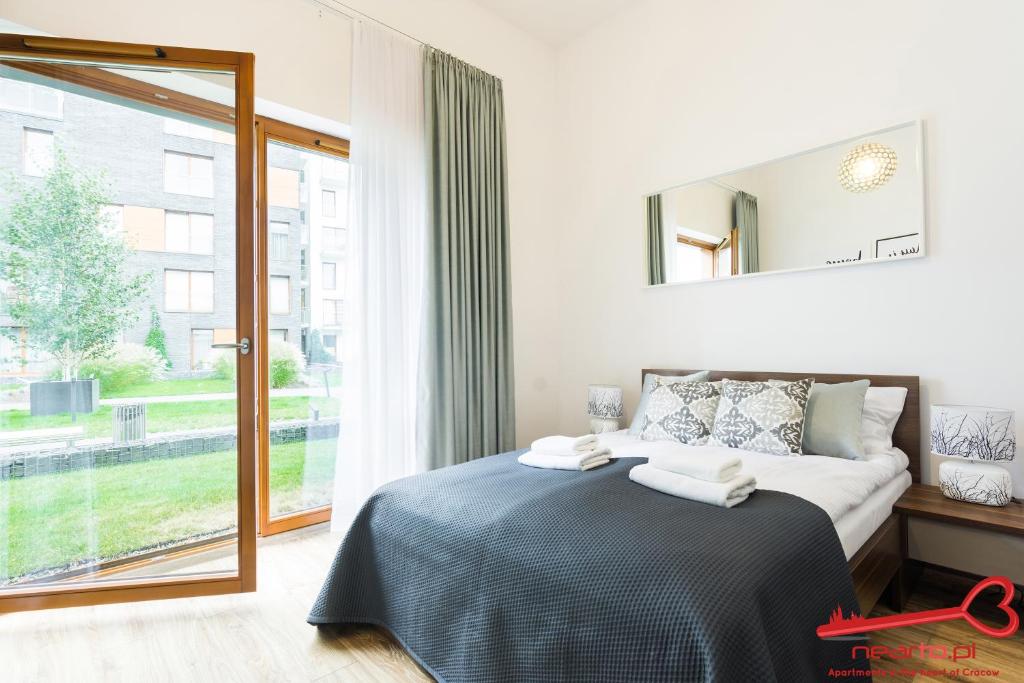 Posteľ alebo postele v izbe v ubytovaní Apartments Nearto Old Town Rakowicka