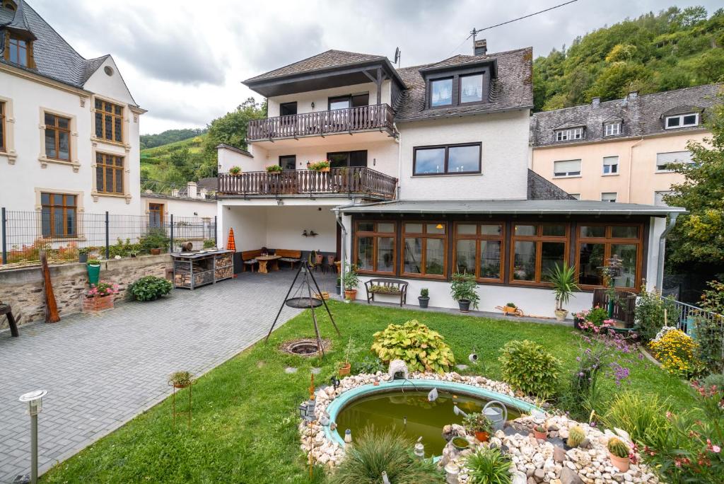 a house with a garden in front of it at Ferienweingut Göbel in Traben-Trarbach