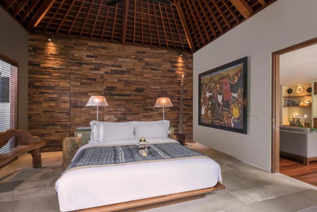 Postel nebo postele na pokoji v ubytování The Purist Villas & Spa Ubud
