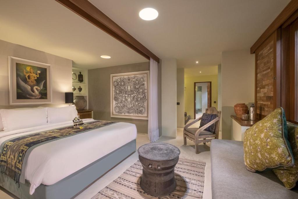 Postel nebo postele na pokoji v ubytování The Purist Villas & Spa Ubud