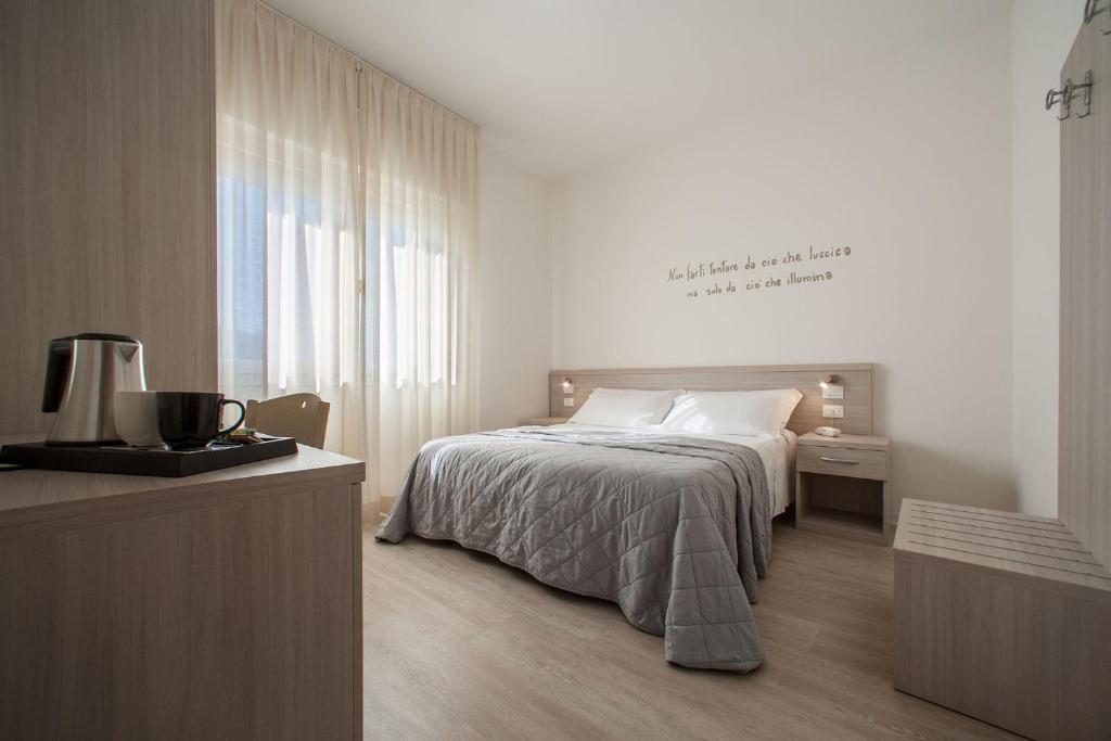 Postel nebo postele na pokoji v ubytování Hotel Anny