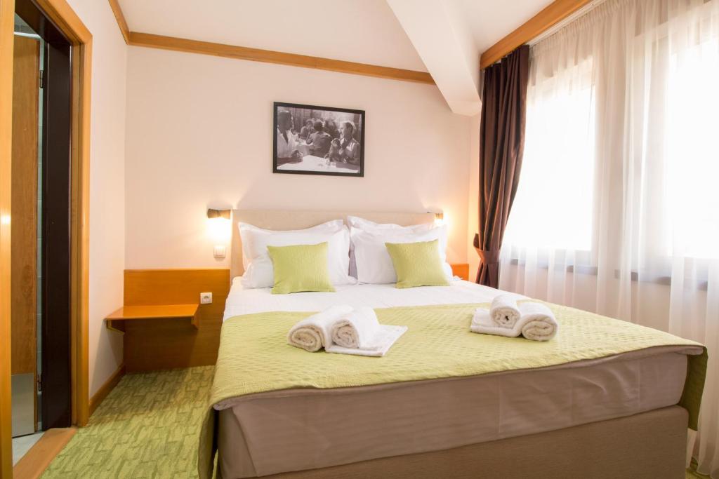 Postel nebo postele na pokoji v ubytování Hotel Yugoslavia