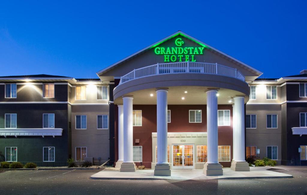a building with a sign that reads cranberry hotel at GrandStay Residential Suites Hotel - Eau Claire in Eau Claire