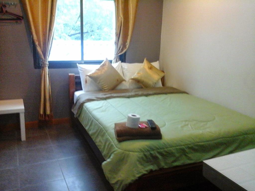 Postel nebo postele na pokoji v ubytování Kohkaew Village 2@Kohsamet