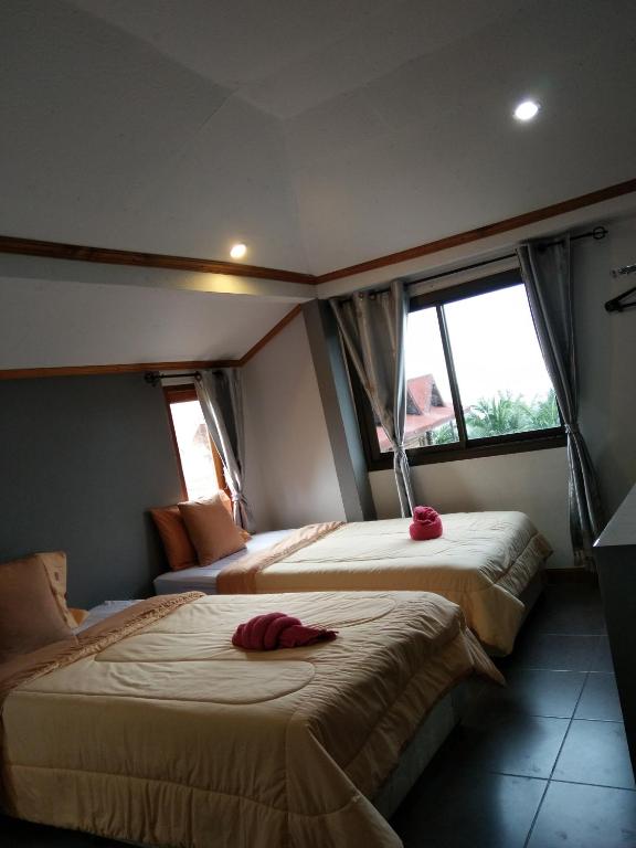 Postel nebo postele na pokoji v ubytování Kohkaew Village 2@Kohsamet