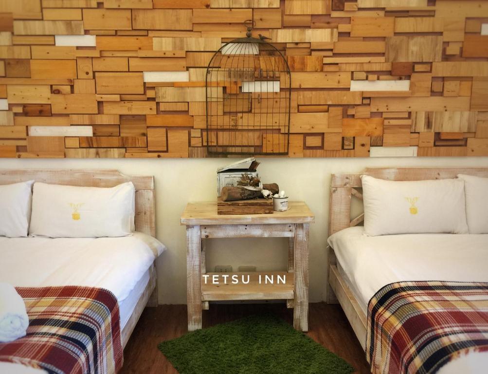 Postel nebo postele na pokoji v ubytování 墾丁寵物友善 鐵宿 Tetsu B&B