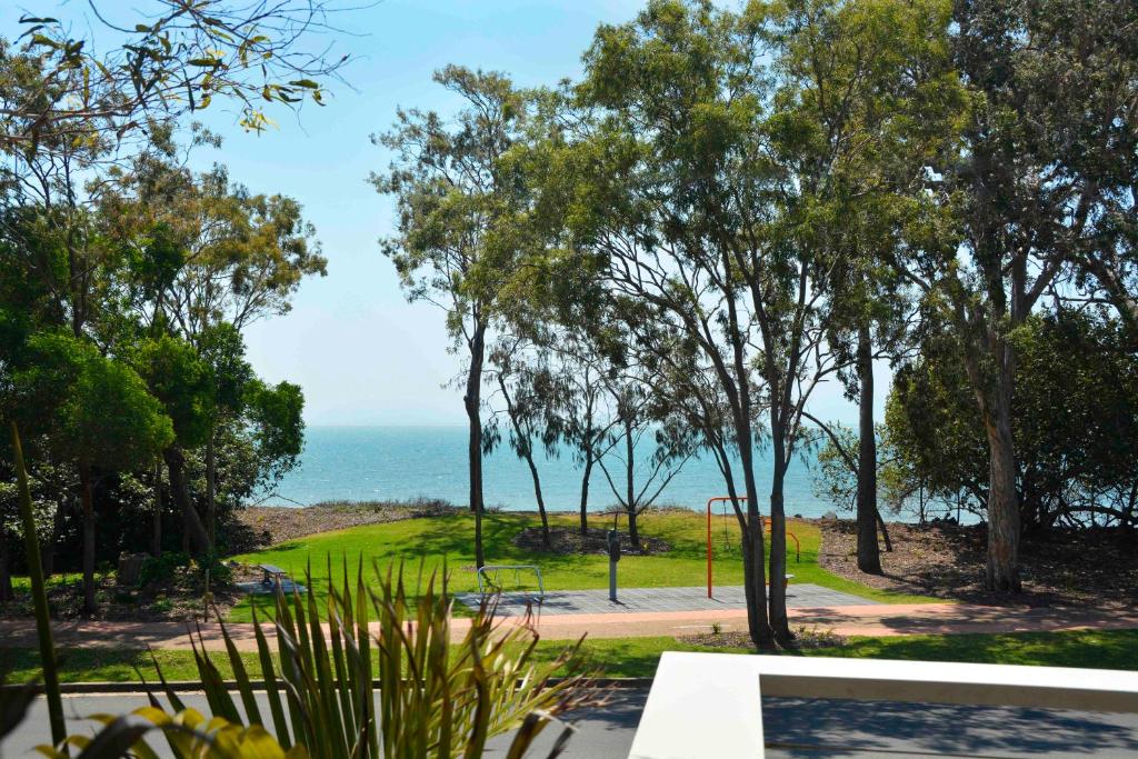 a view of the ocean from a park at 545 Esplanade in Hervey Bay