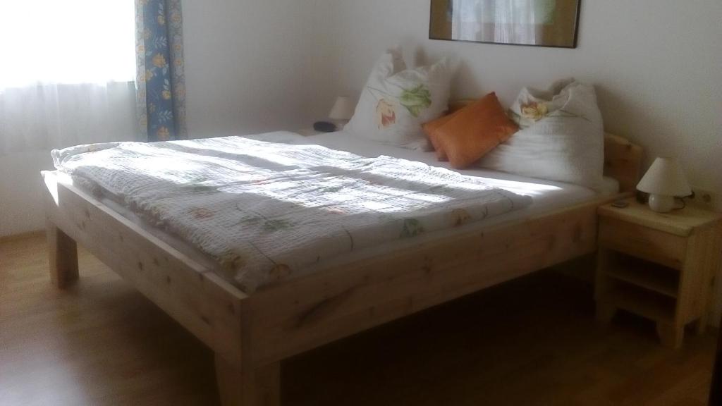 A bed or beds in a room at Apartments Grabler