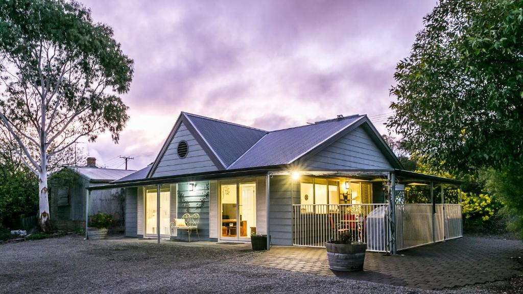 a house with a solar roof on top of it at One Tree Accommodation in Auburn