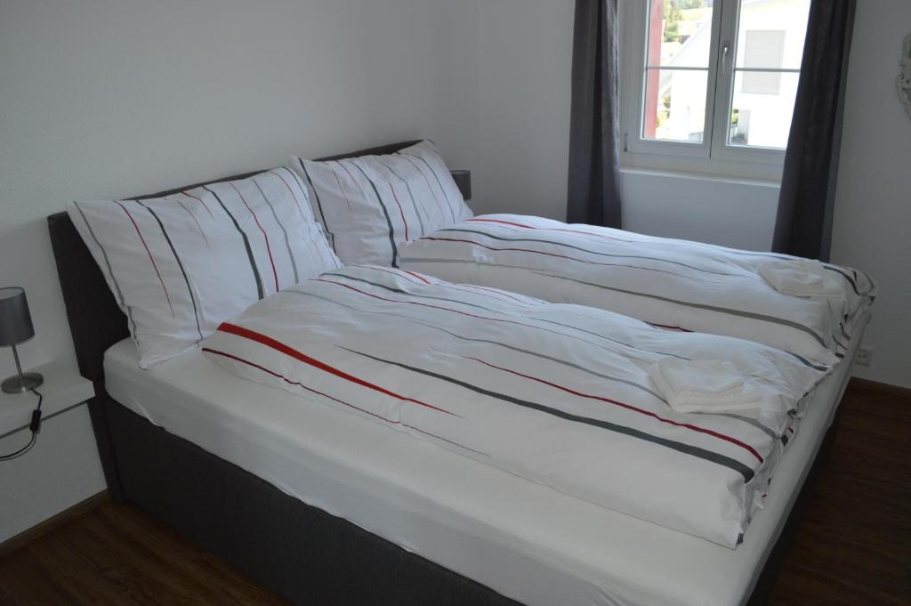 Postel nebo postele na pokoji v ubytování BnB zum Schlüssel