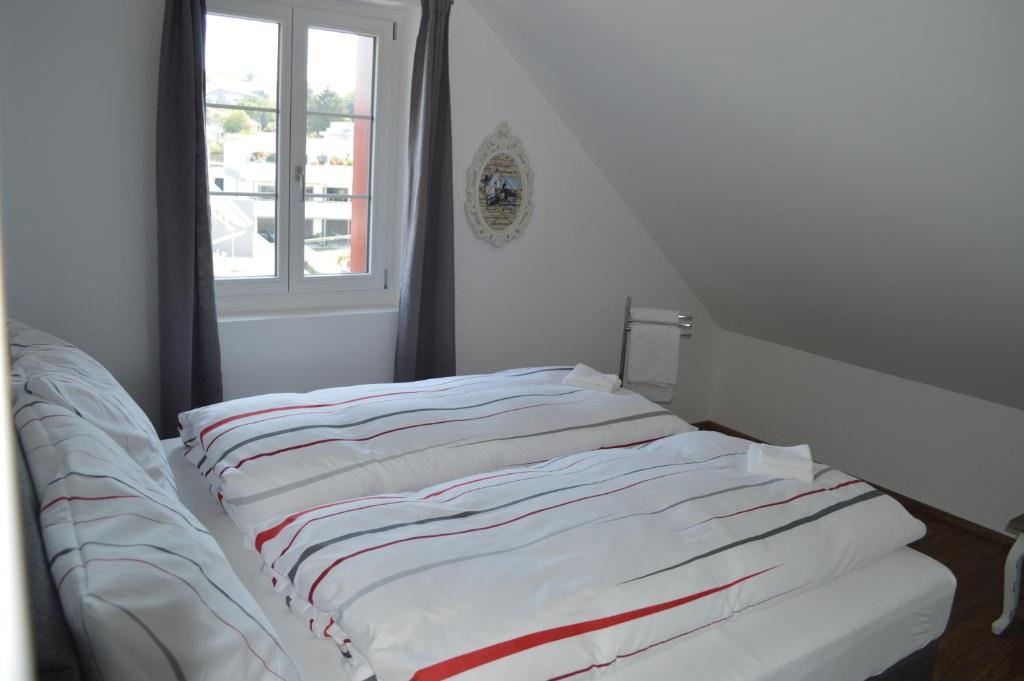 Postel nebo postele na pokoji v ubytování BnB zum Schlüssel