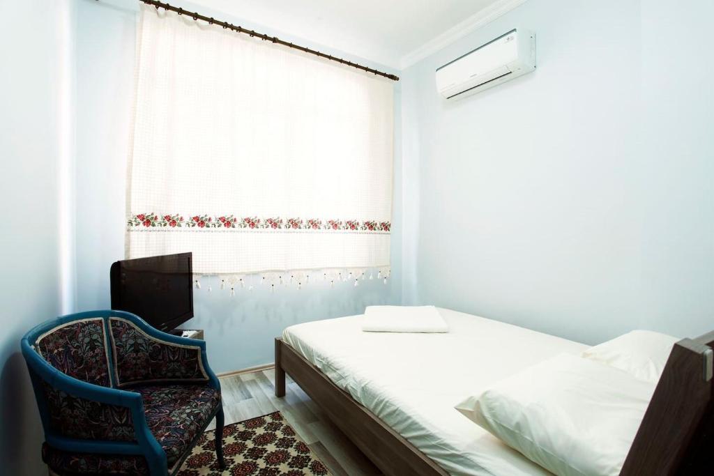 Postel nebo postele na pokoji v ubytování Blue Suites by V