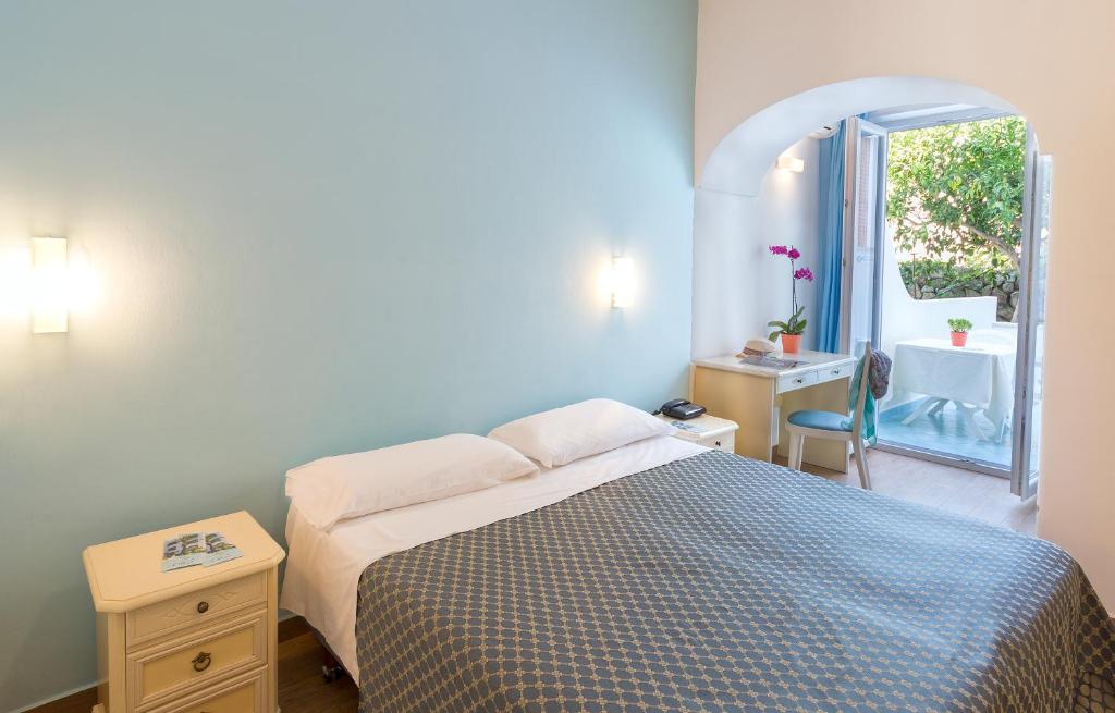Postel nebo postele na pokoji v ubytování Hotel Costa Citara