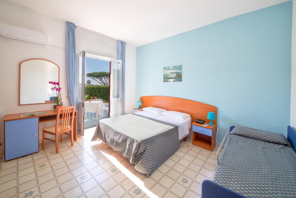 Postel nebo postele na pokoji v ubytování Hotel Costa Citara
