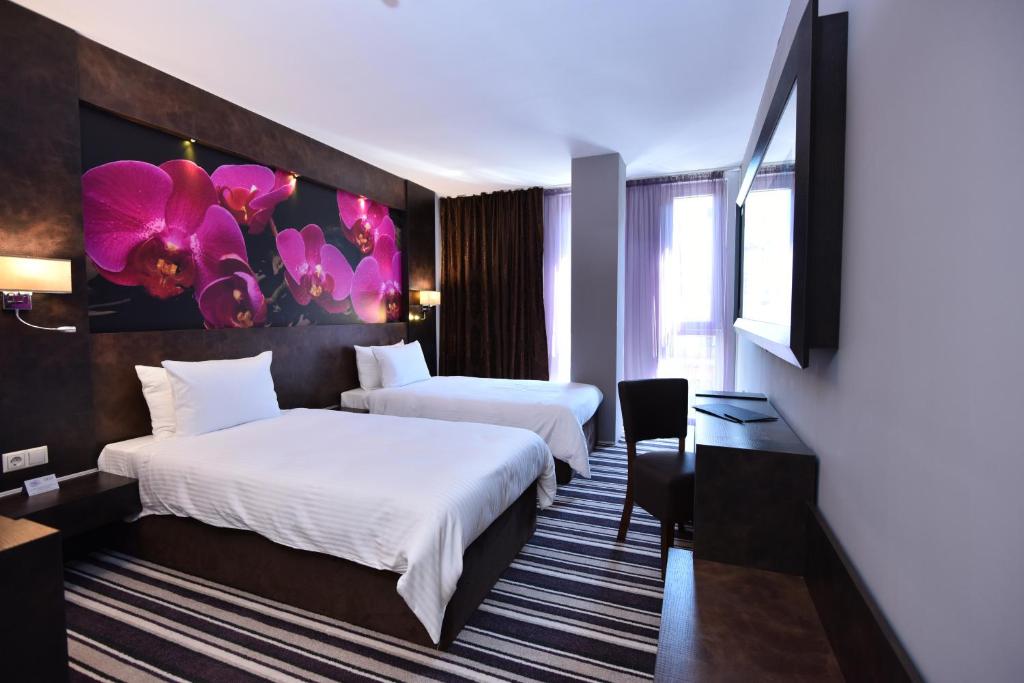 Postel nebo postele na pokoji v ubytování Best Boutique Hotel