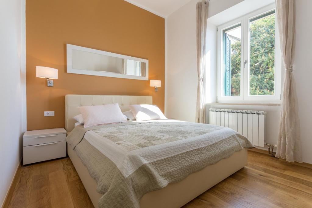 Posteľ alebo postele v izbe v ubytovaní Apartments Villa Victoria