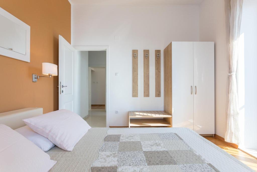 Posteľ alebo postele v izbe v ubytovaní Apartments Villa Victoria