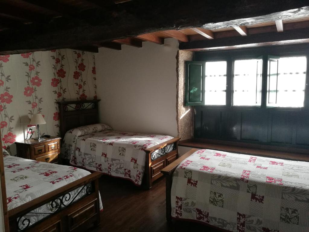 Postel nebo postele na pokoji v ubytování Casa de los Somoza