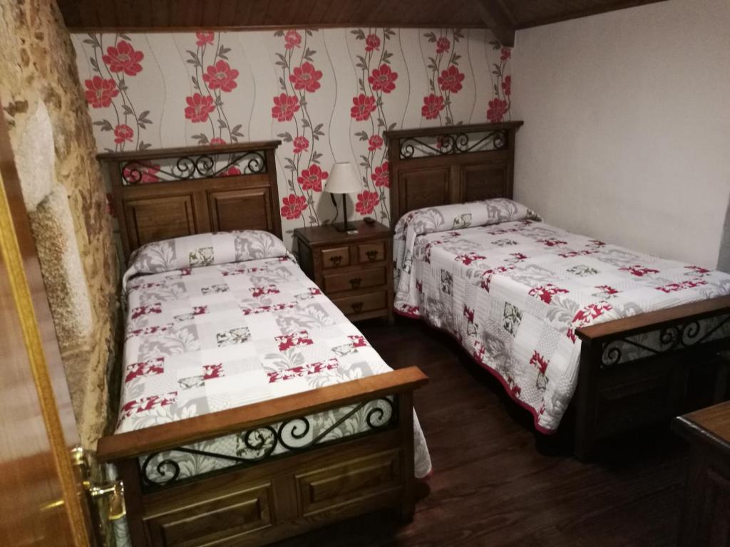 Postel nebo postele na pokoji v ubytování Casa de los Somoza
