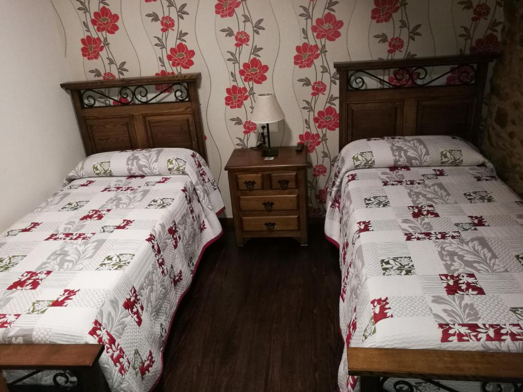 Postel nebo postele na pokoji v ubytování Casa de los Somoza