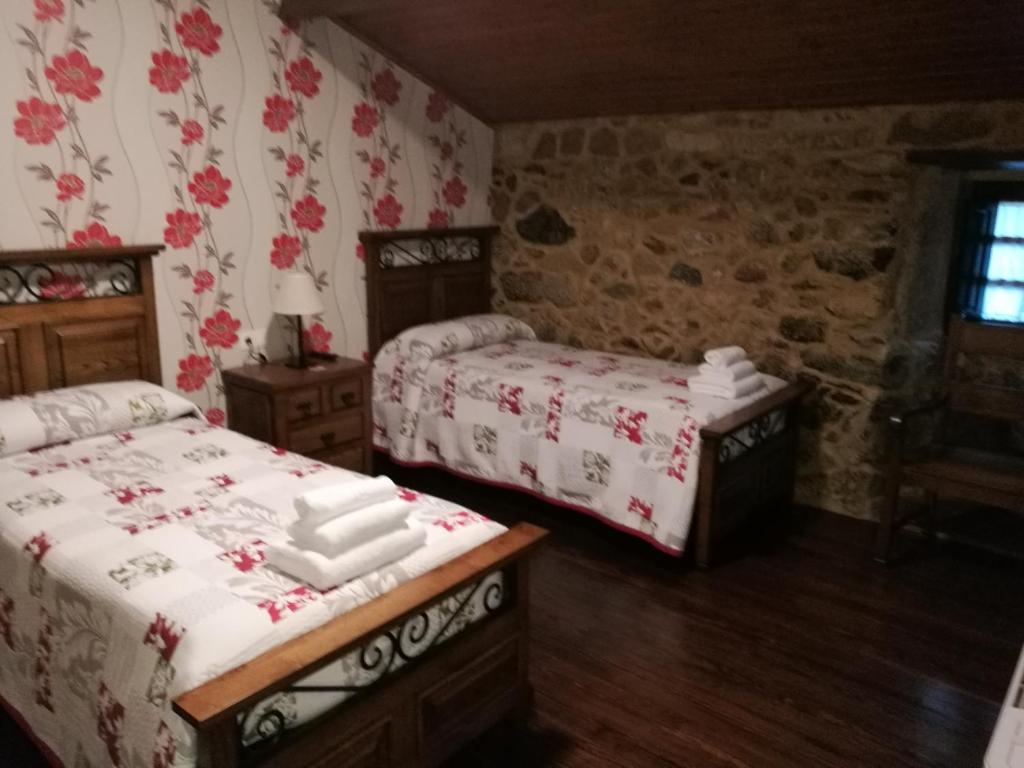 Postel nebo postele na pokoji v ubytování Casa de los Somoza