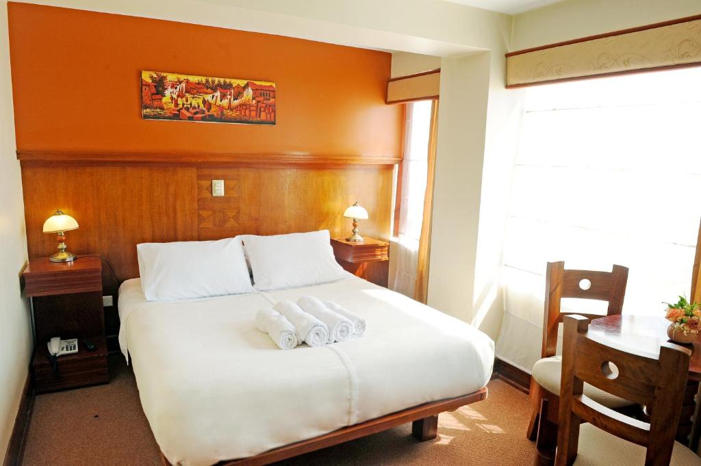 Postel nebo postele na pokoji v ubytování Hotel Waynapicchu