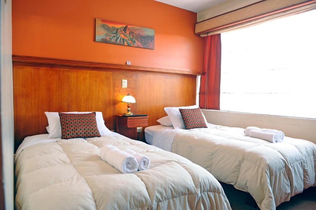 Postel nebo postele na pokoji v ubytování Hotel Waynapicchu