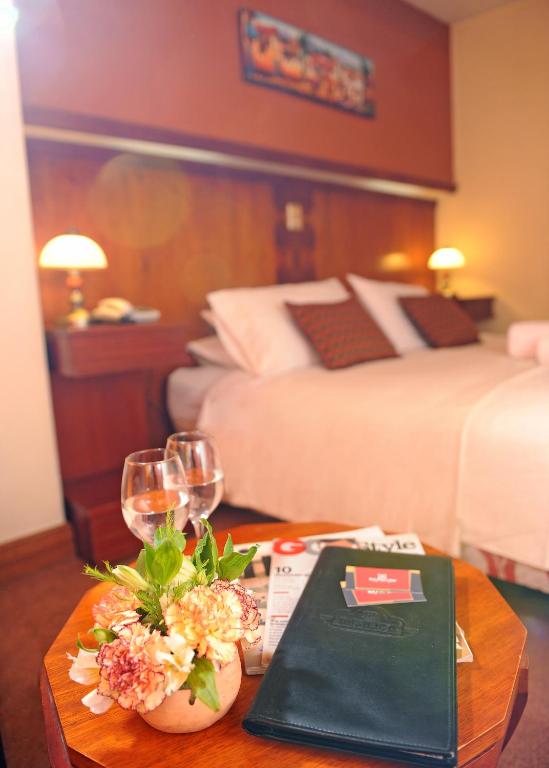 Postel nebo postele na pokoji v ubytování Hotel Waynapicchu