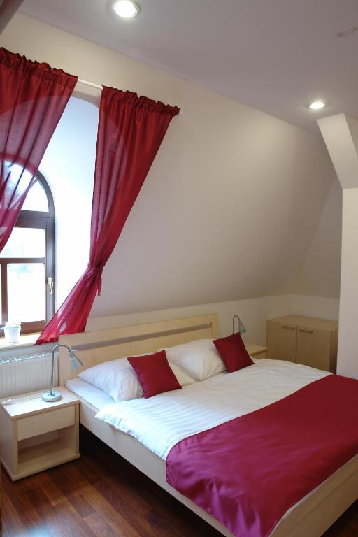 Postel nebo postele na pokoji v ubytování Hotel Střelnice