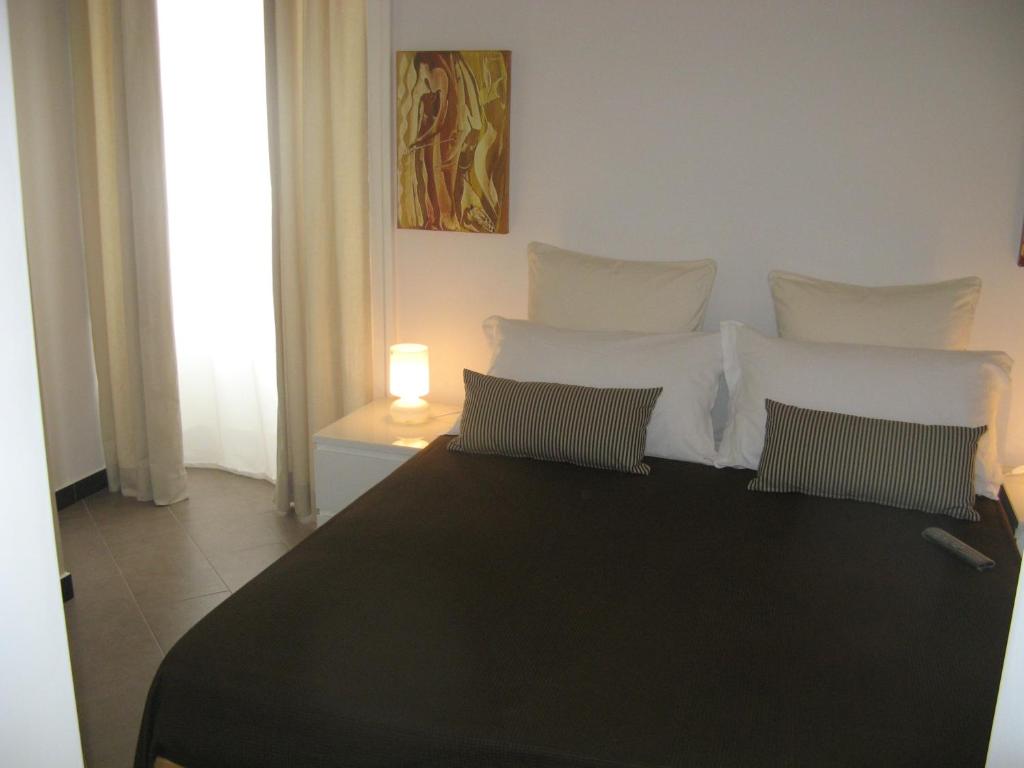 Postel nebo postele na pokoji v ubytování iBed Napoli B&B