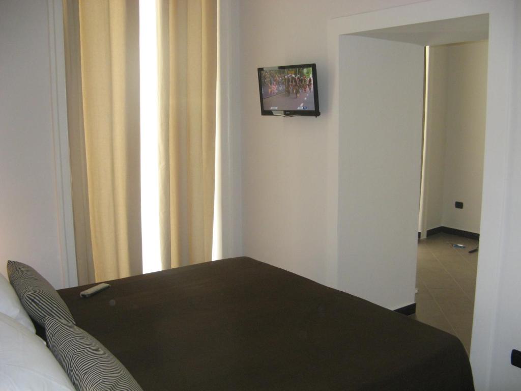 Postel nebo postele na pokoji v ubytování iBed Napoli B&B